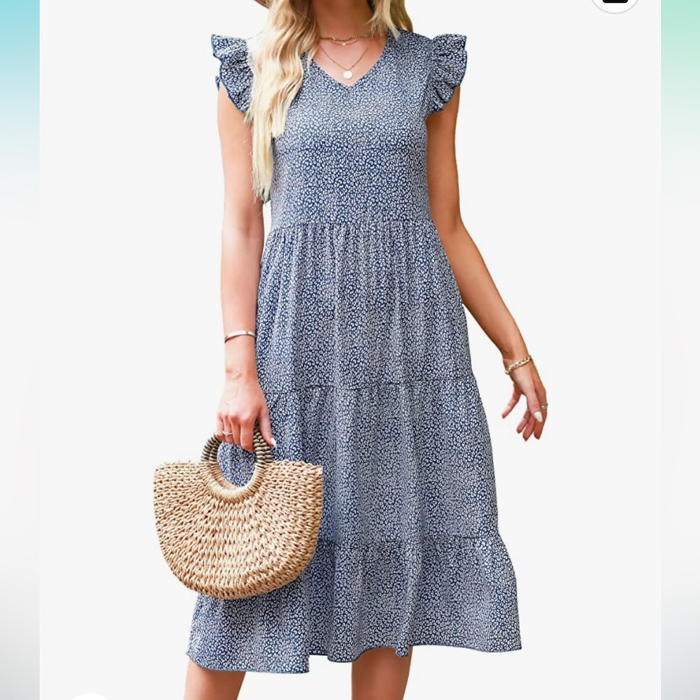 Spring midi dress with ruffle sleeve and tiered skirt. Blue and white dots